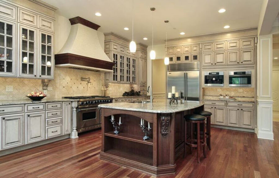 Traditional kitchen remodel with a wood island, tiled backsplash and hardwood floors